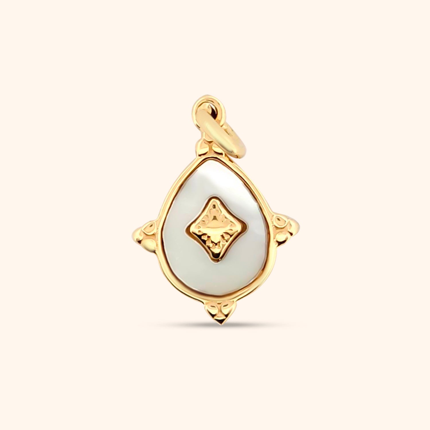 Close-up of the Luminescence Charm, a teardrop-shaped charm featuring a mother-of-pearl inlay and gold detailing.